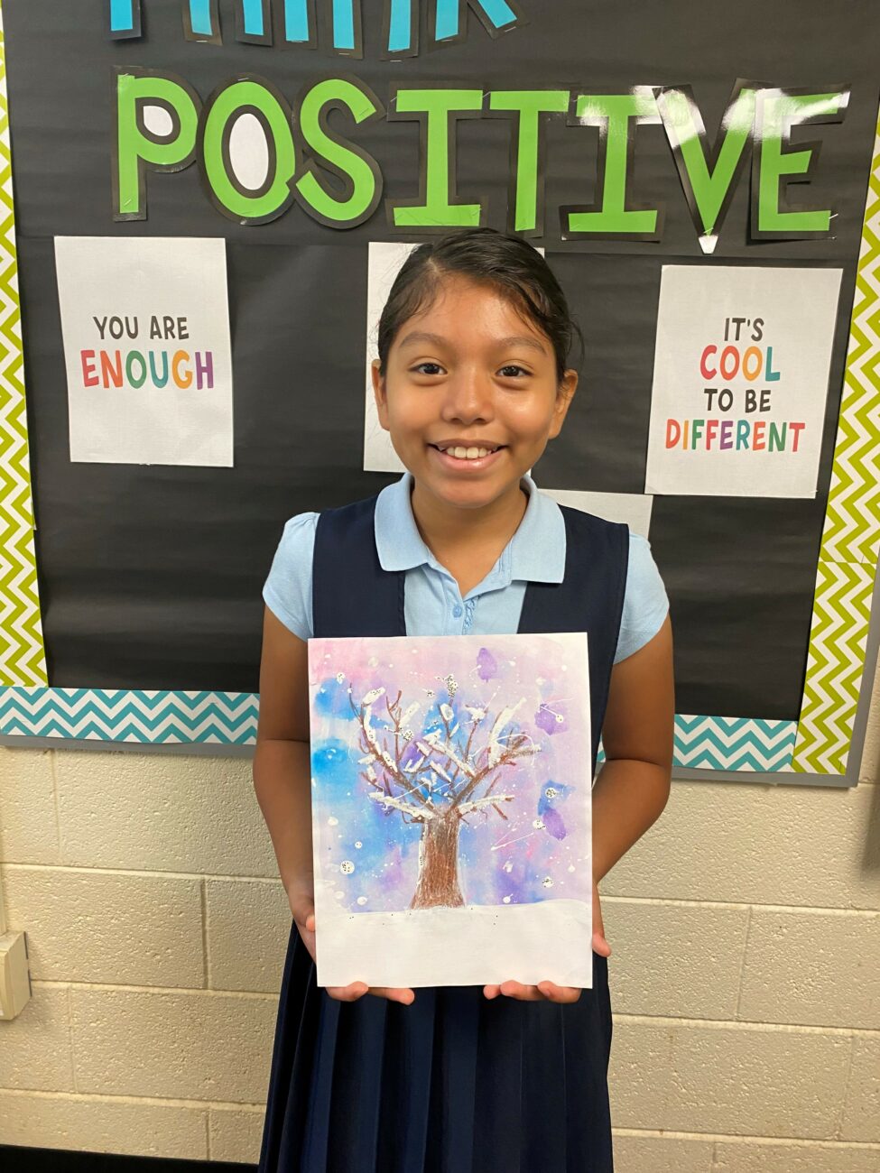 Monserrat holding artwork