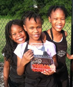 Zemaya (far left) and her cousins in the garden at Winterfield Elementary School