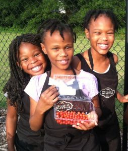 Zemaya (far left) and her cousins in the garden at Winterfield Elementary School